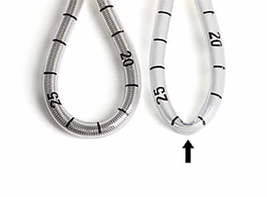 Manufacturers utilize a coil-reinforced design, incorporating a soft, medical-grade plastic tube with an internal helical coil spring for added strength.